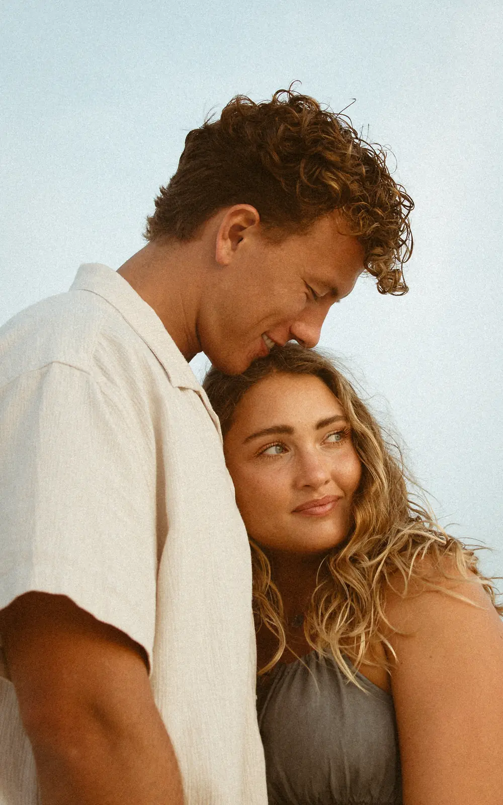 Close-up portrait of a couple embracing by the Gulf